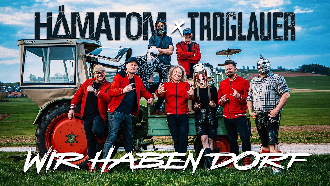 Standbild aus dem Musikvideo „Wir haben Dorf“: Hämatom und Troglauer vor einem alten Fendt-Traktor auf einem Feld